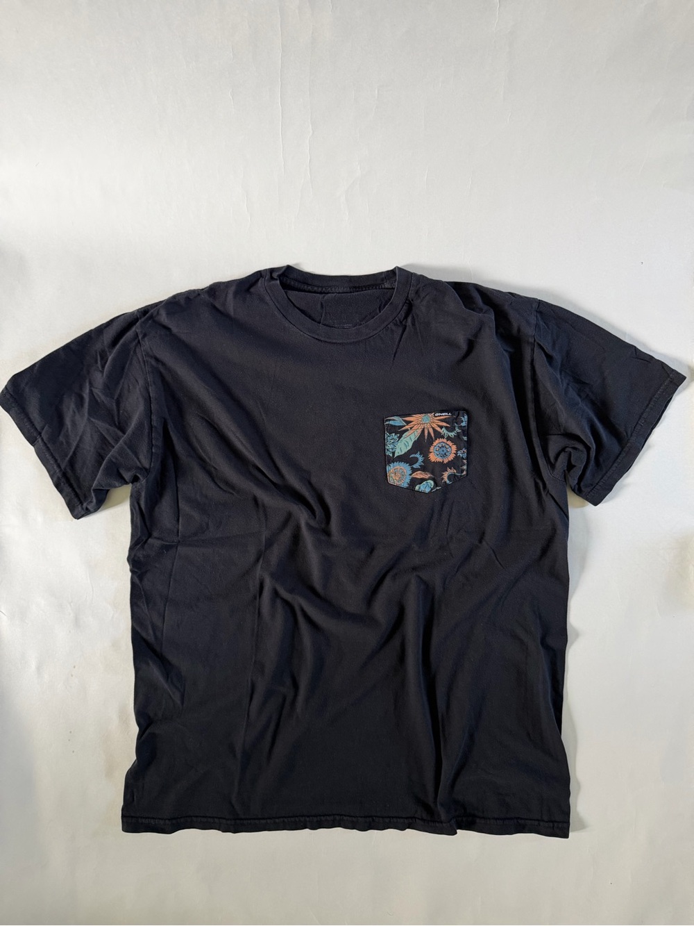 O’Neill Surf Men's Black Pocket Tee with Floral Accent